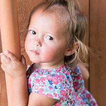 photo of a female toddler wearing floral blouse